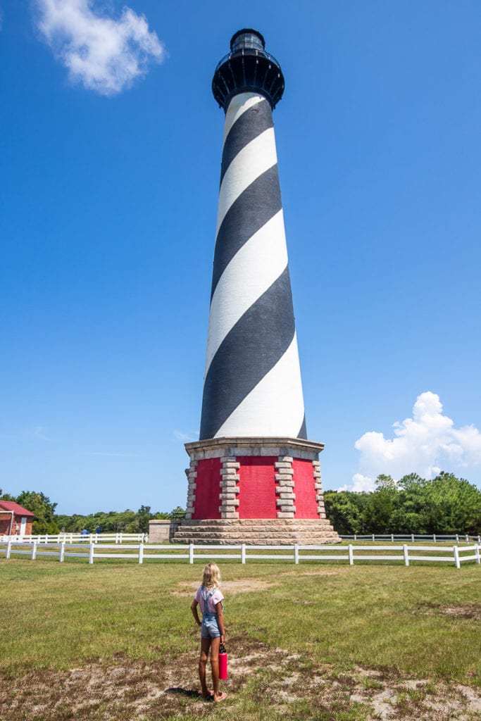 young girl lookig at Cape Hatteras Lighthouse, Outer Banks