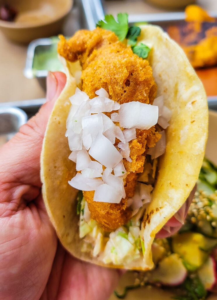 A close up of a chicken taco