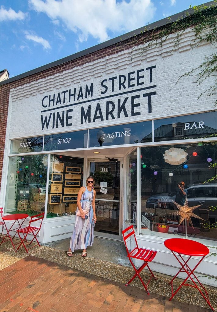 girl standing outside Chatham Street Wine Market, Cary