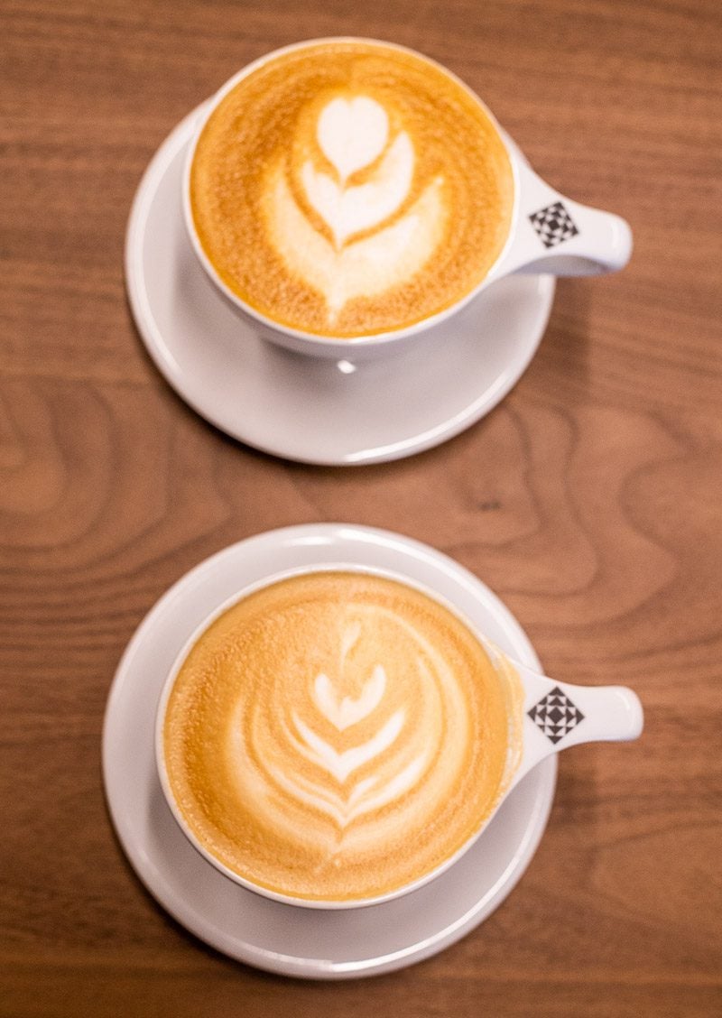 two lattes on table