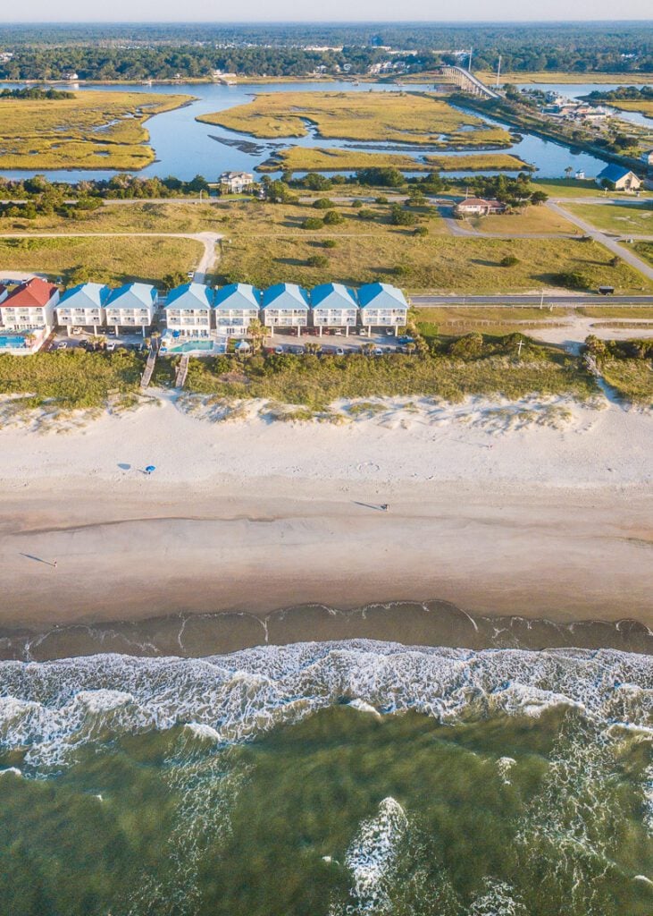 aerial view of Ocean Isle Inn on beach with sound behind