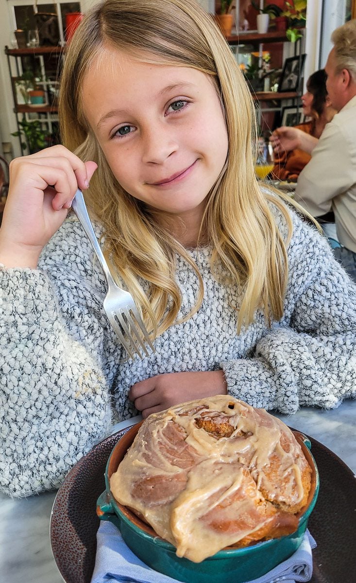 young girl with cinnamon bun at  Rosewater Kitchen & Bar, North Hills