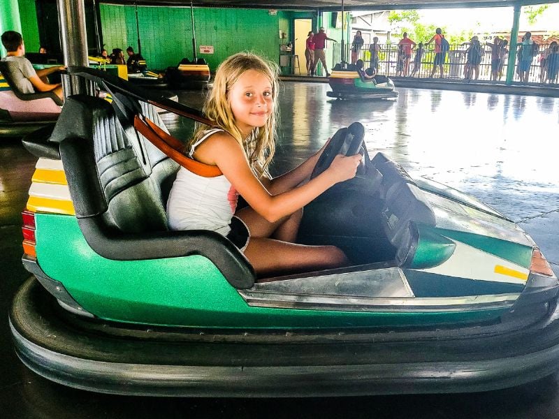 Girl driving a dodge em car at Carowinds Amusement Park