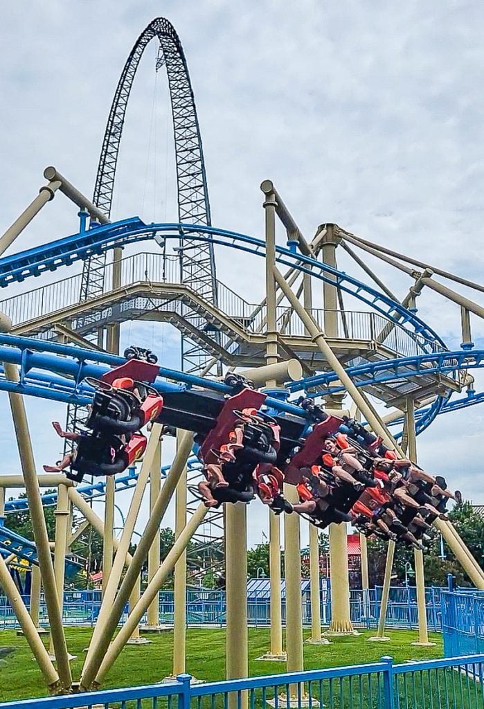 People riding a roller coaster at Carowinds Amusement Park