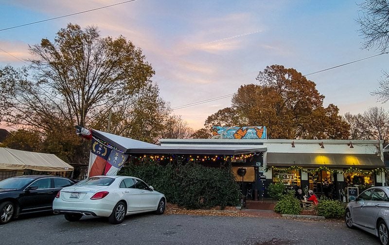 Cars parked out the fron of a restaurant, the Stanbury in Raleigh