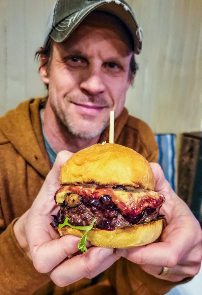 Man holding a burger in his hands