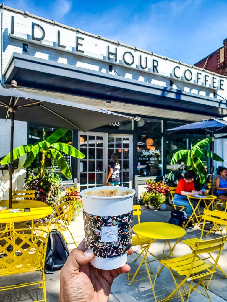 Cup of coffee and yellow tables and chairs - Idle Hour Coffee Shop, Raleigh