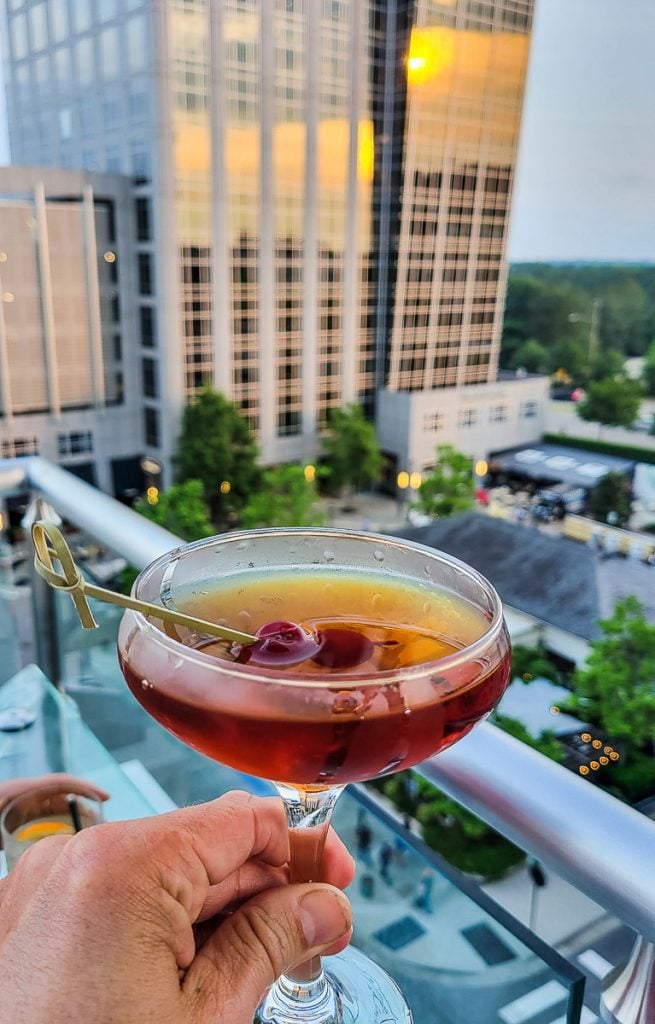 Cocktail glass with a building in the background