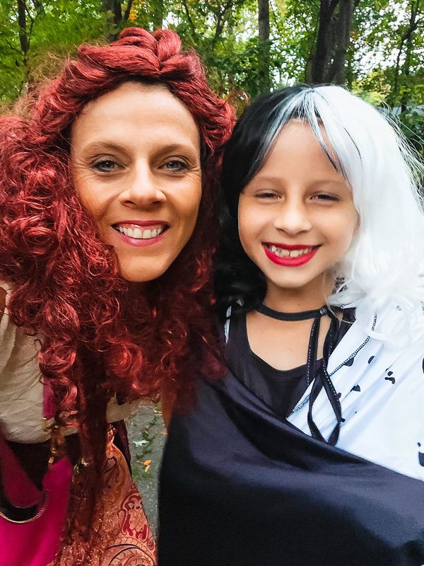 woman and girl in halloween costumes