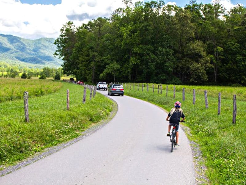 Girl riding her bike on a road in the Smoky Mountains