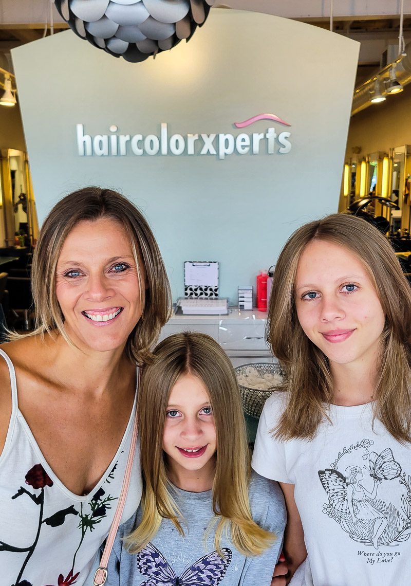 Three ladies posing for photo at the hairdressers