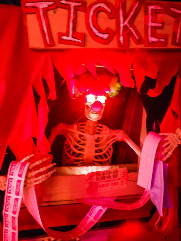 neon skeleton collecting tickets