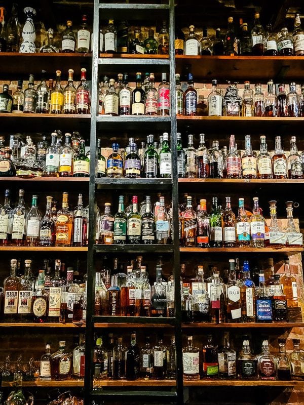 Liquor bottles on shelves in a bar