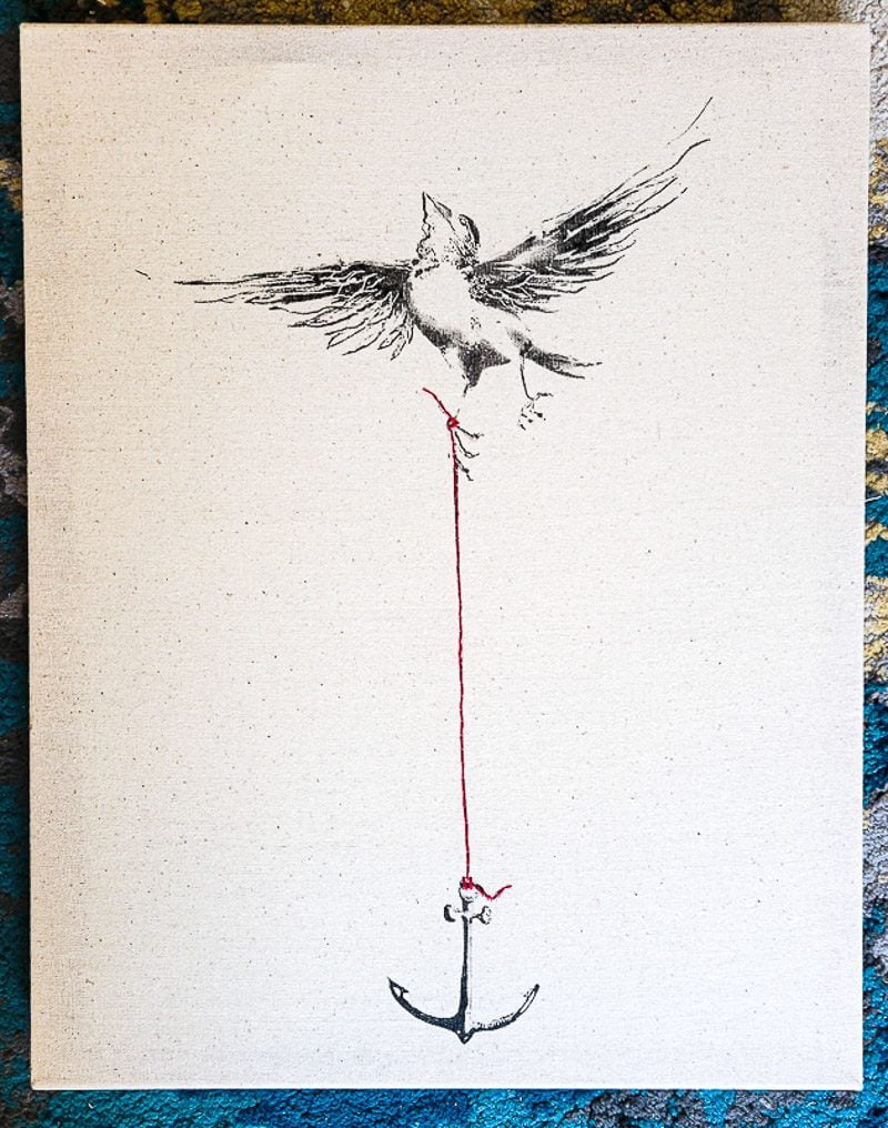 Painting of a bird carrying a hook