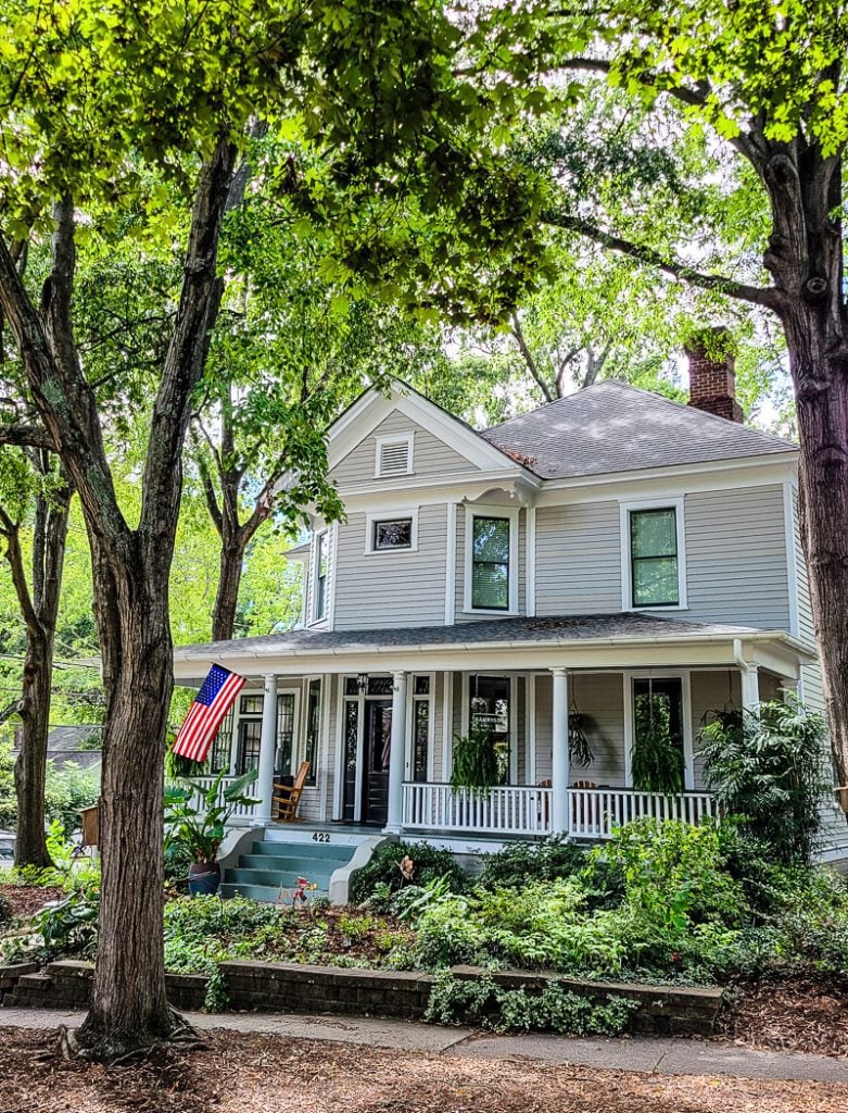A Southern home with front porch and American flag