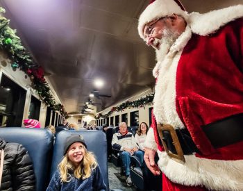 Santa talking to a child on a train - The Polar Express