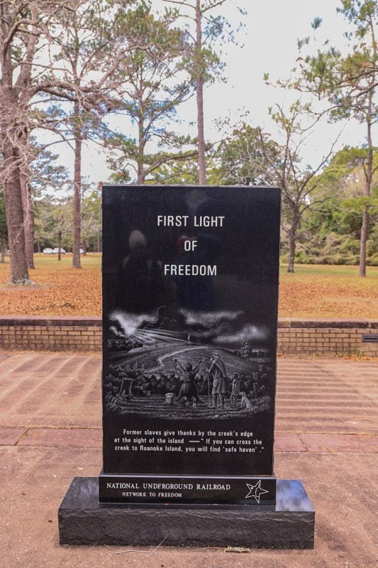 plaque honoring the first light of freedom