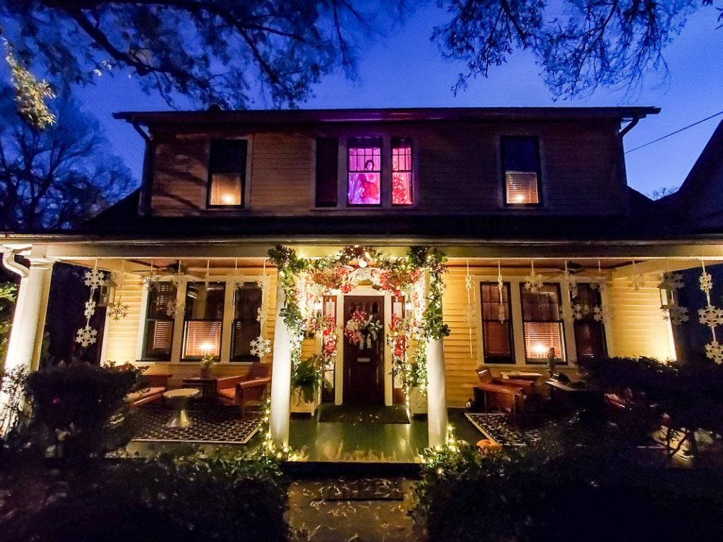 Front porch of historic Southern home with Christmas decorations