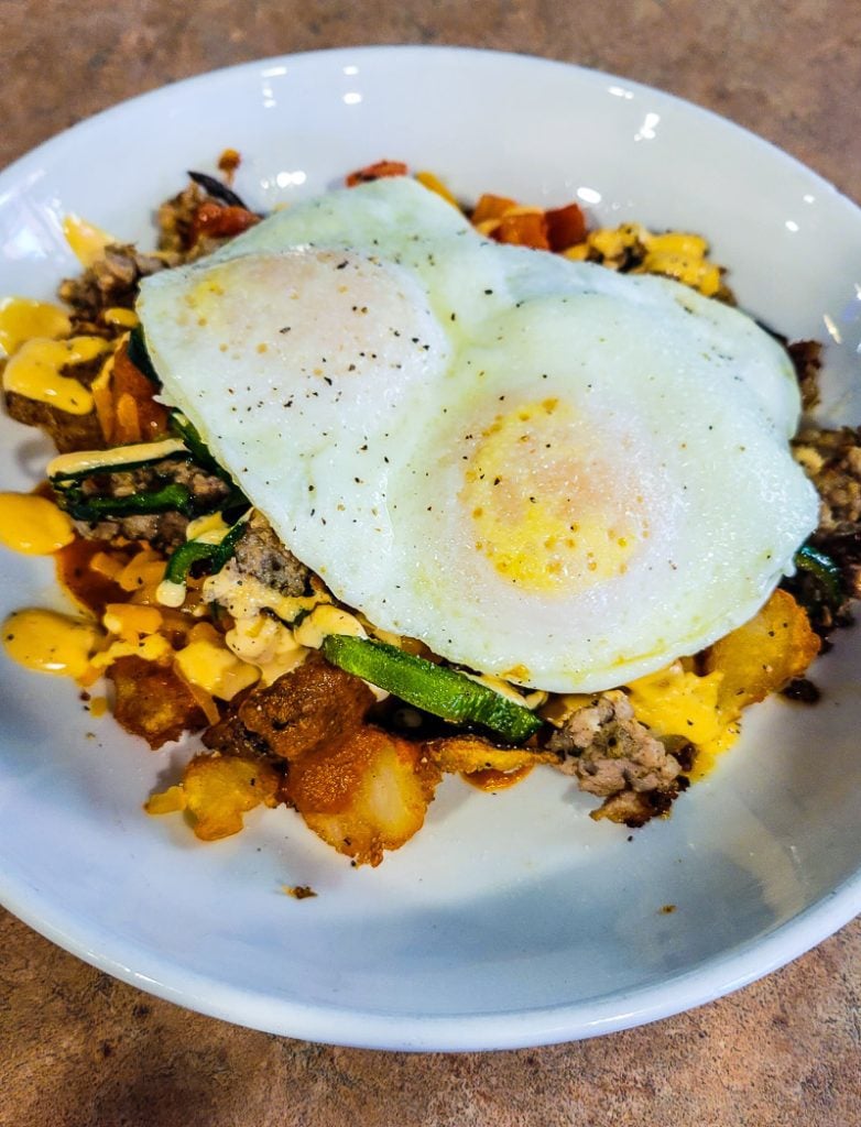 Eggs on top of a veggie hash