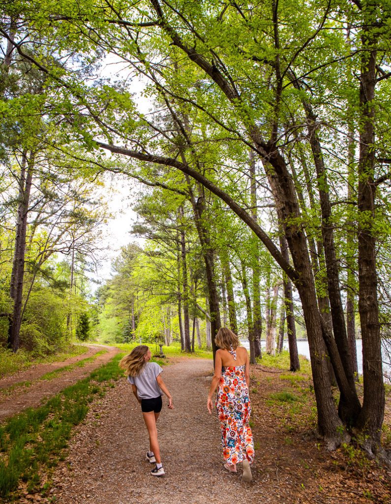 Mom and daughter walking a nature trail