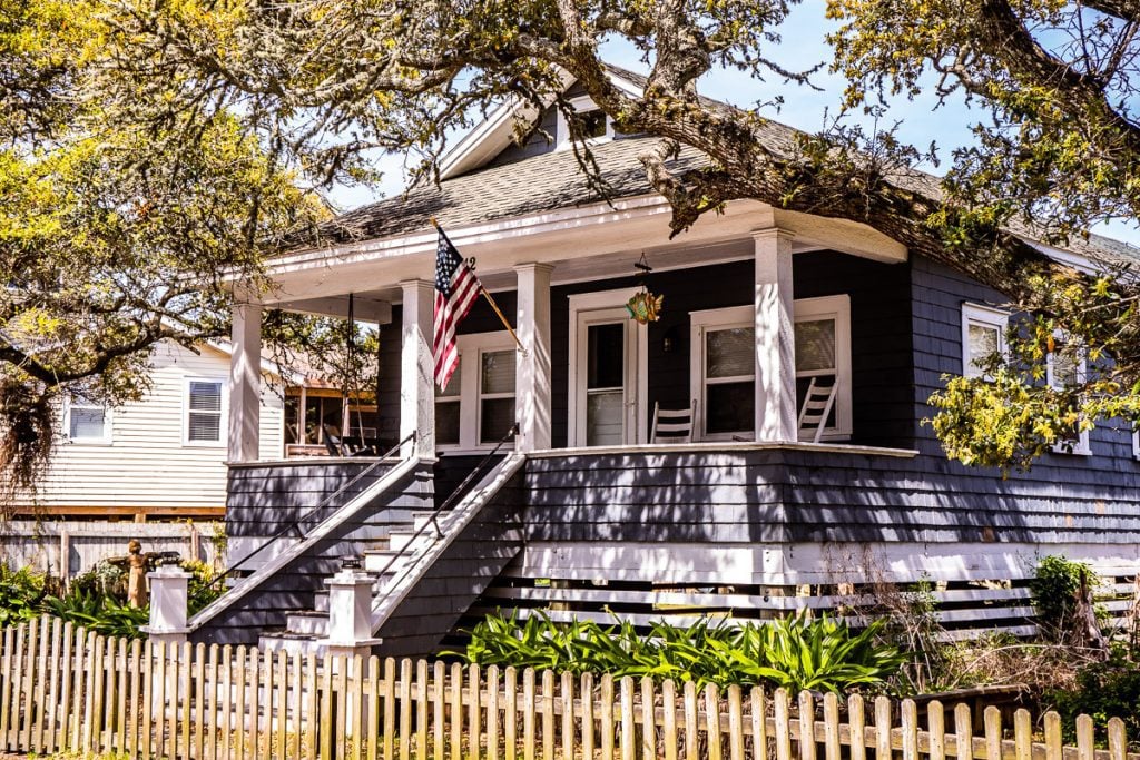 Southern home with porch and American flag