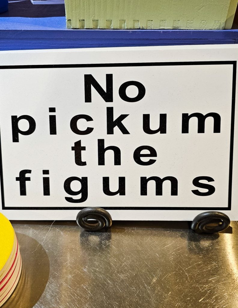 Sign saying "no pickum the figums