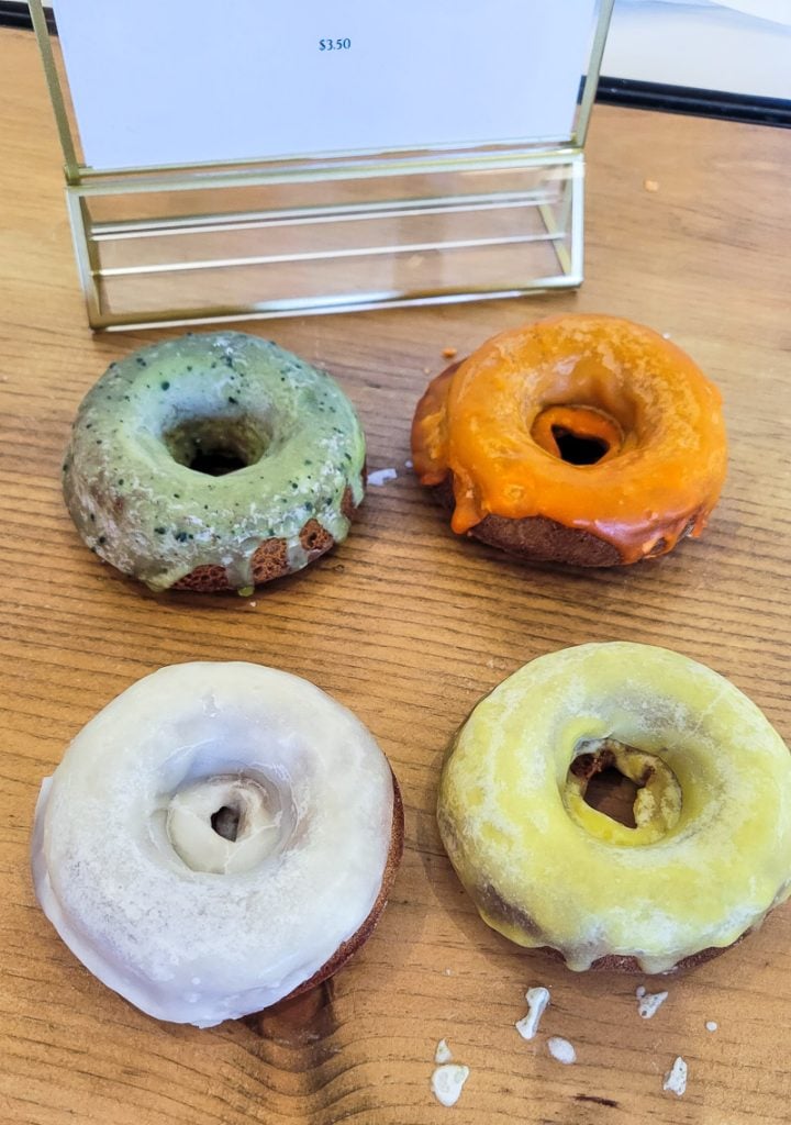 Four donuts on a table
