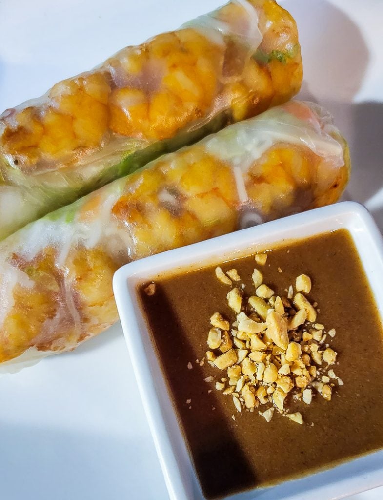 Two spring rolls with peanut sauce