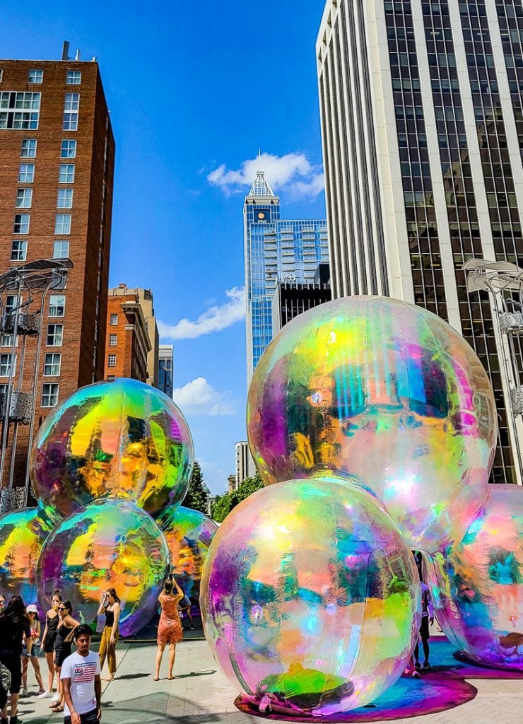 Giant colorful balls on a city street for an arts festival