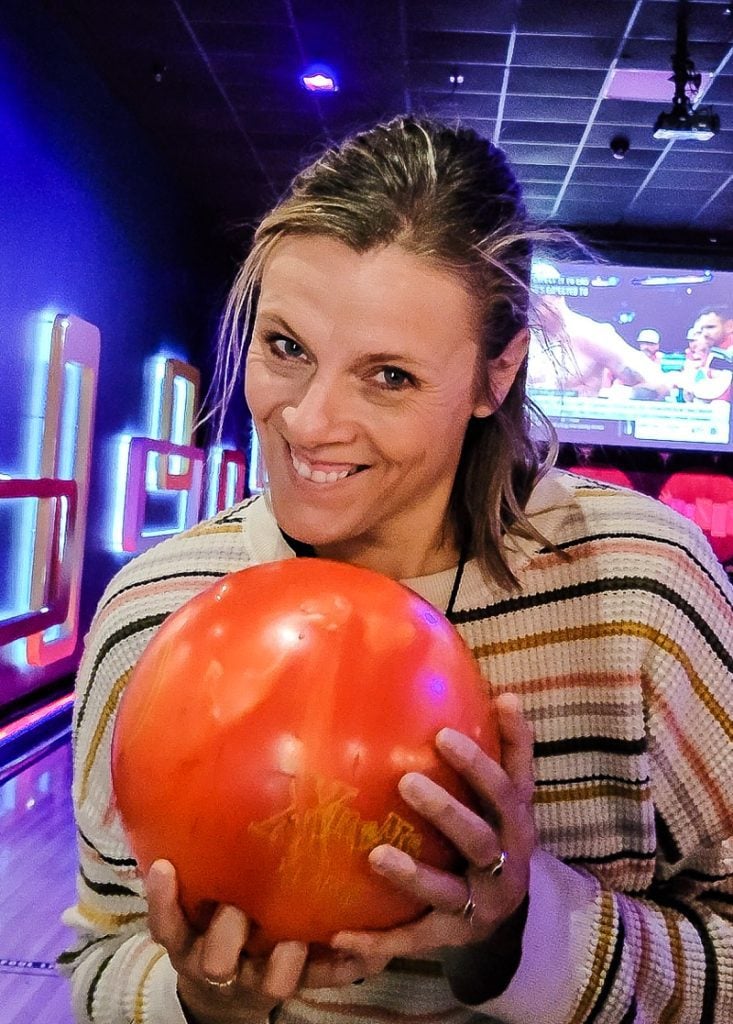 Lady holding a bowling ball