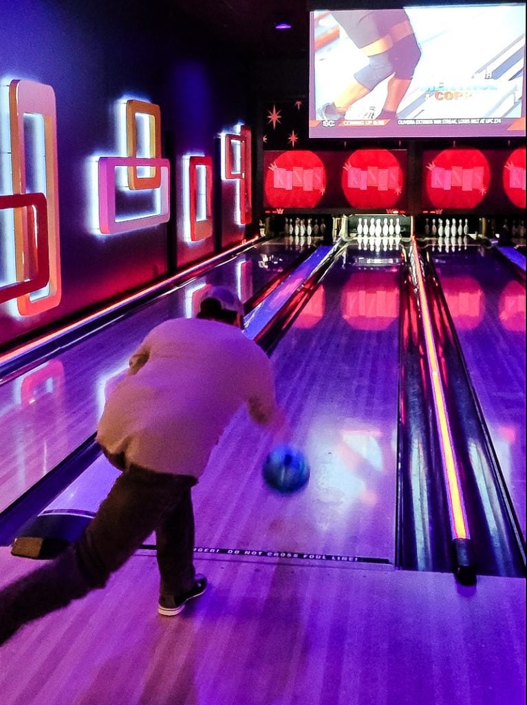 Man bowling a bowling ball