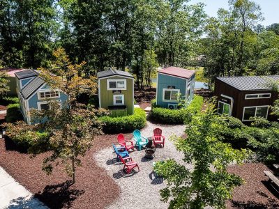 4 tiny homes around a fire pit