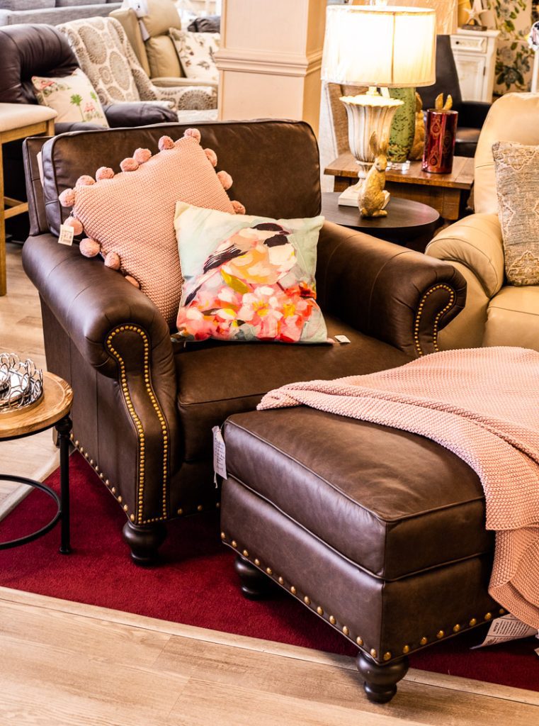Brown leather chair on display in a store