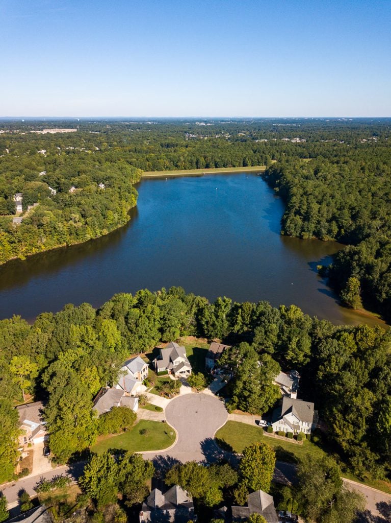 Aerial photo of a lake surrounded by forest