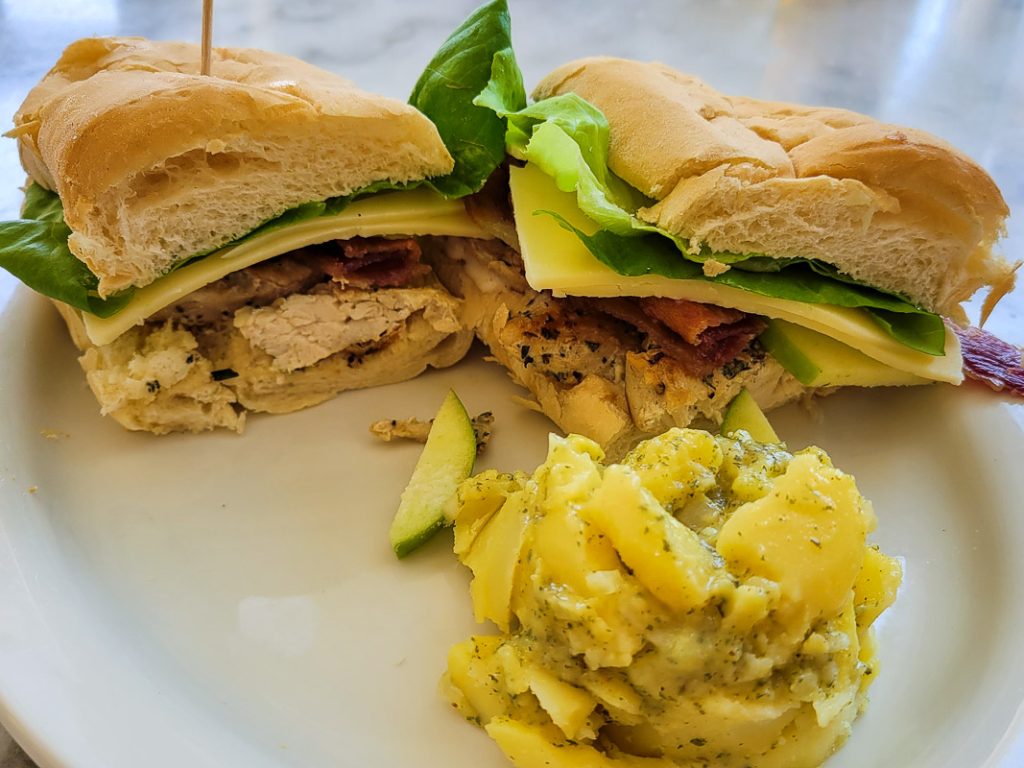Club sandwich with potato salad