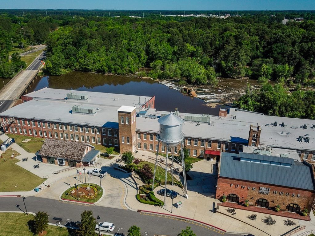 Aerial photo of an old mill turned into restaurants and breweries.