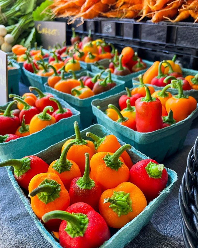 Red peppers on display at a market