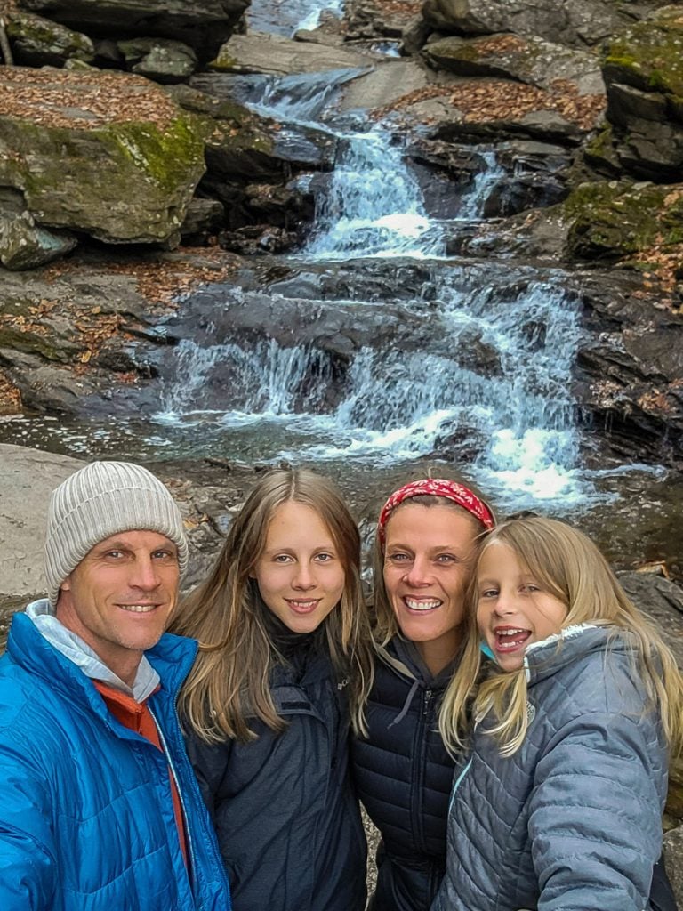 Family in front of a waterfall