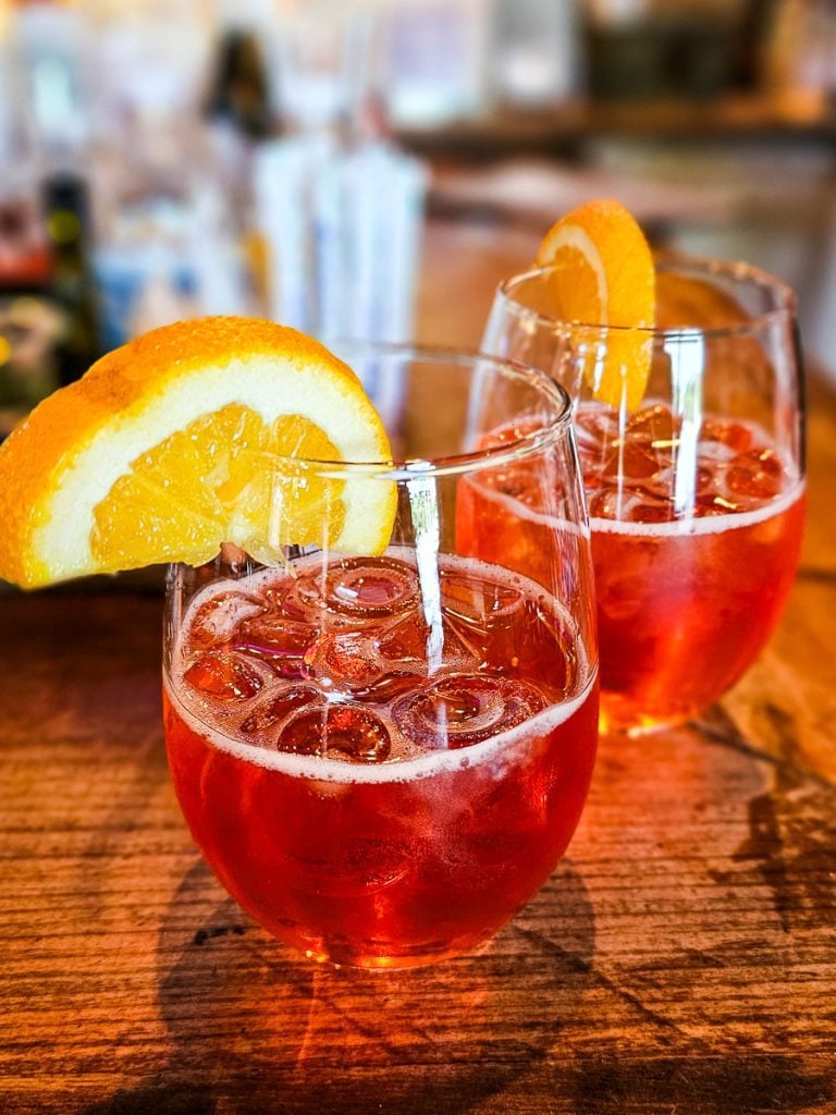 Two cocktails glasses with aperol spritz