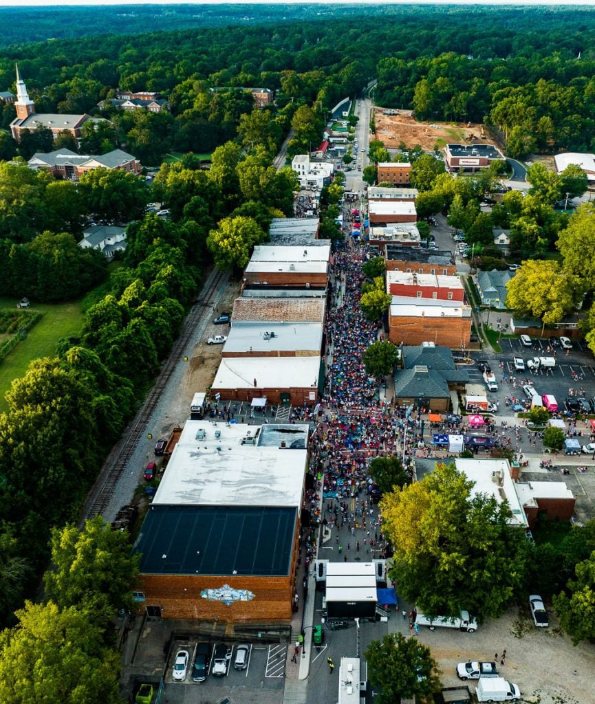Hundreds of people at a street festival in downtown Wake Forest