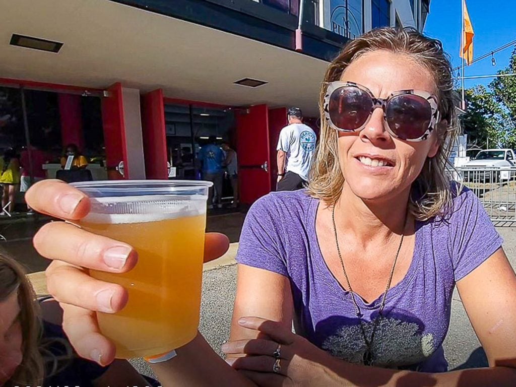 Woman holding a cup of beer