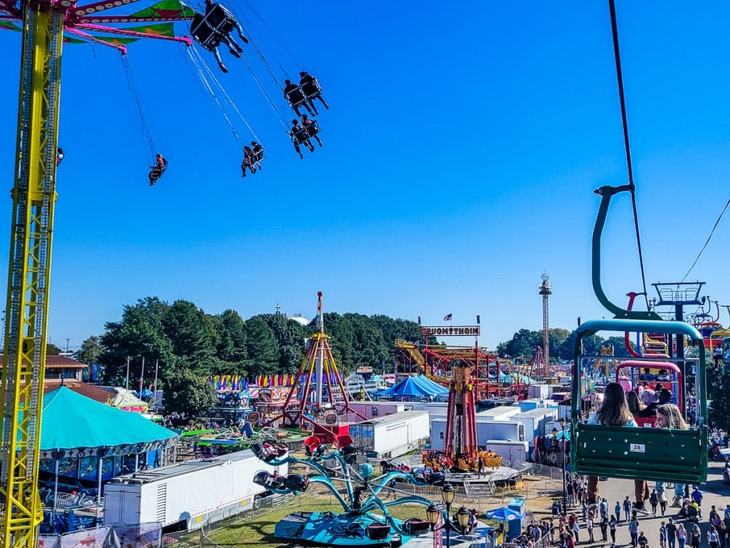 Rides and people at a festival
