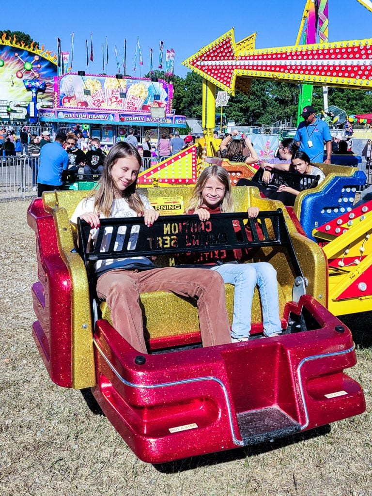 Kids on a ride at a festival