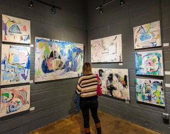 Woman at an art gallery looking at art