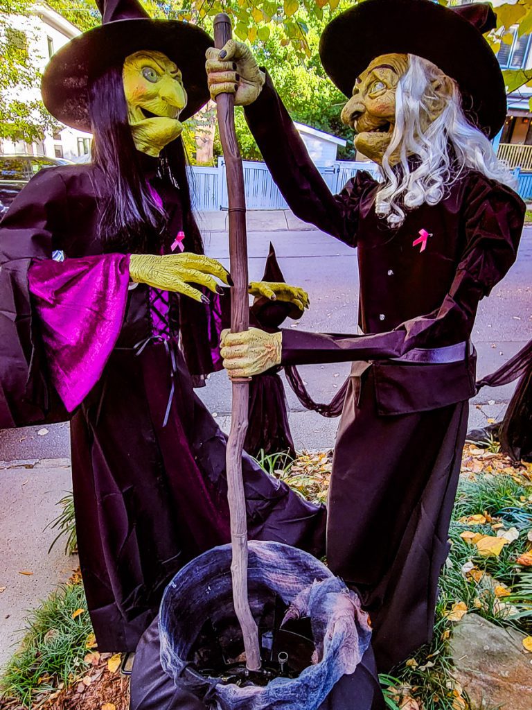 Two witches stirring a pot.