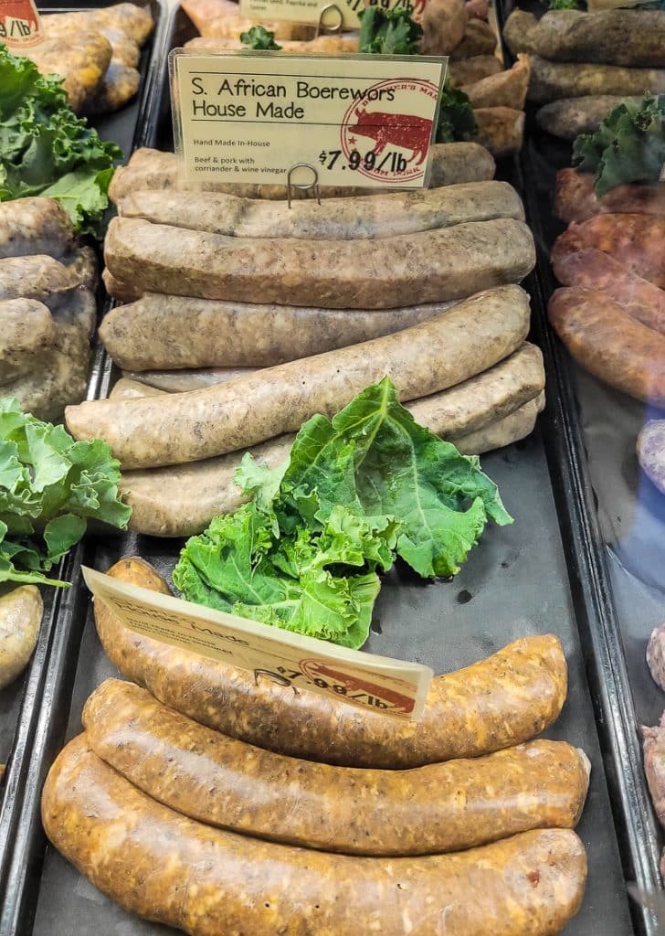 Sausages on display in a butcher shop.