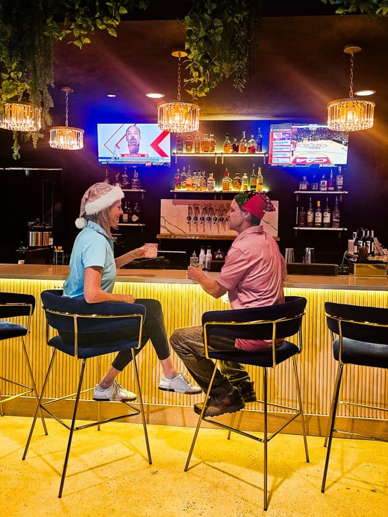 Man and woman sitting at a bar.
