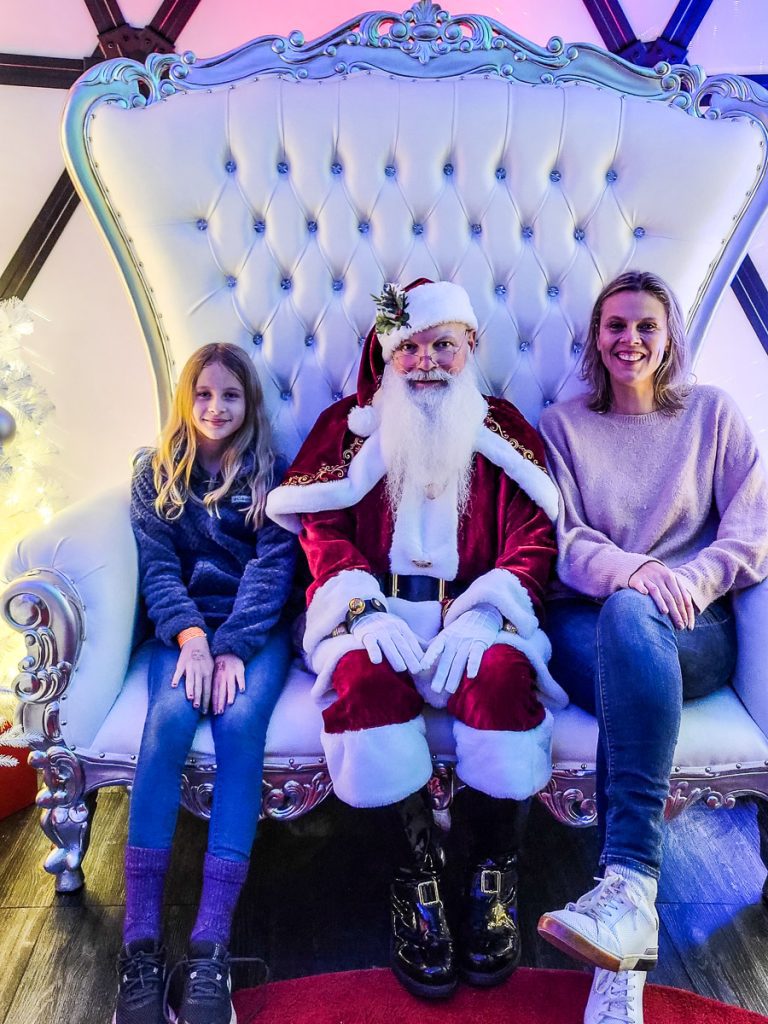 Mom and daughter with Santa.