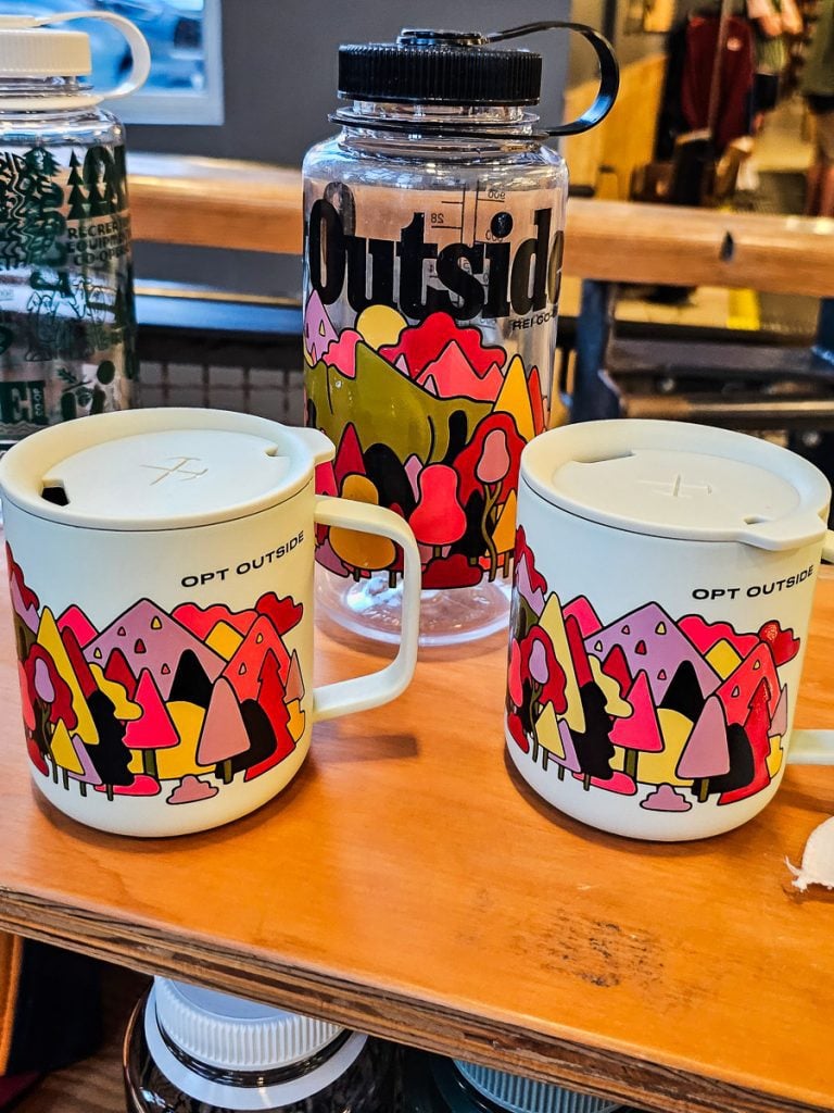 Coffee mugs on display in a store.