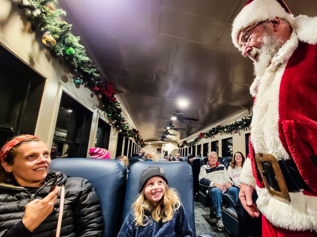 Santa on the polar express train with kids and adults in Bryson City, North Carolina.